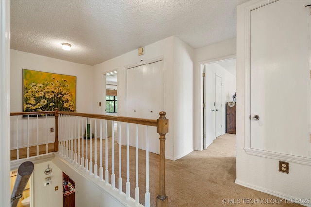 7033 E 99th St, Tulsa, OK 74133 - hall with carpet flooring, an upstairs landing, and a textured ceiling