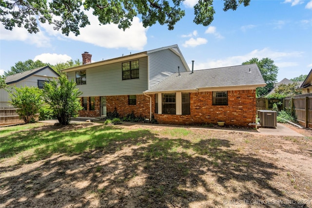 7033 E 99th St, Tulsa, OK 74133 - back of property with brick siding and a chimney