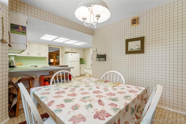 7033 E 99th St, Tulsa, OK 74133 - dining room featuring baseboards