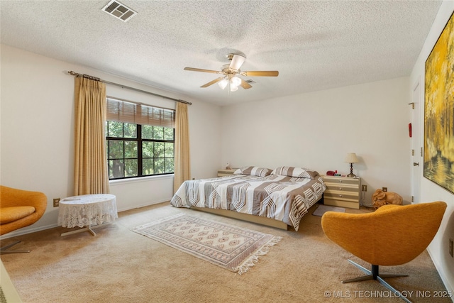 7033 E 99th St, Tulsa, OK 74133 - carpeted bedroom with a textured ceiling and a ceiling fan