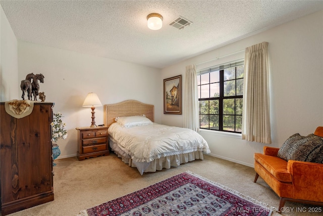 7033 E 99th St, Tulsa, OK 74133 - carpeted bedroom featuring a textured ceiling and baseboards