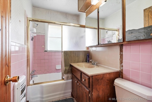 705 W Hartford Pl, Broken Arrow, OK 74012 - full bathroom with vanity, bathtub / shower combination, wallpapered walls, heating unit, and tile walls