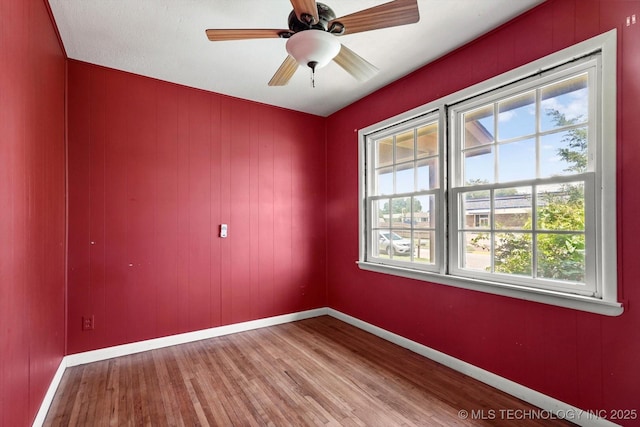 705 W Hartford Pl, Broken Arrow, OK 74012 - spare room featuring wood finished floors and baseboards