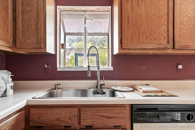 705 W Hartford Pl, Broken Arrow, OK 74012 - kitchen featuring dishwashing machine, light countertops, and brown cabinetry