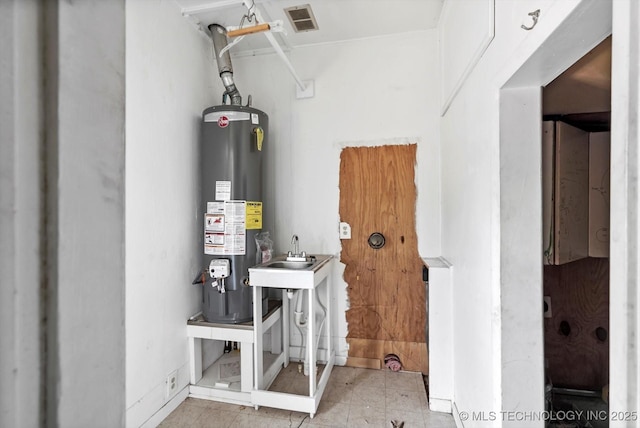 705 W Hartford Pl, Broken Arrow, OK 74012 - utility room featuring water heater and a sink