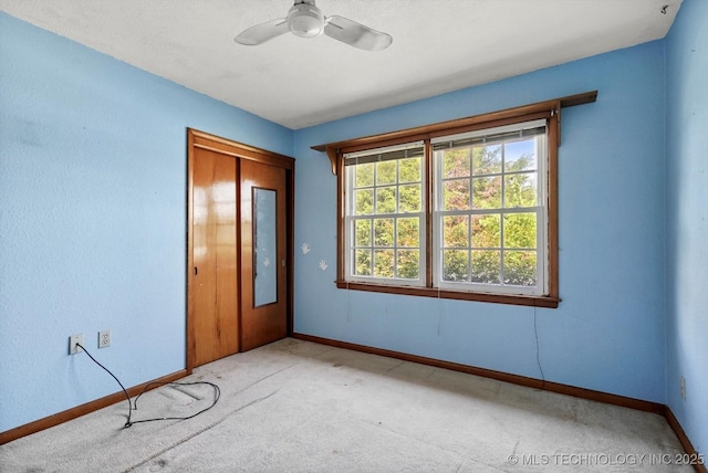 705 W Hartford Pl, Broken Arrow, OK 74012 - unfurnished bedroom featuring carpet floors, a closet, and a ceiling fan