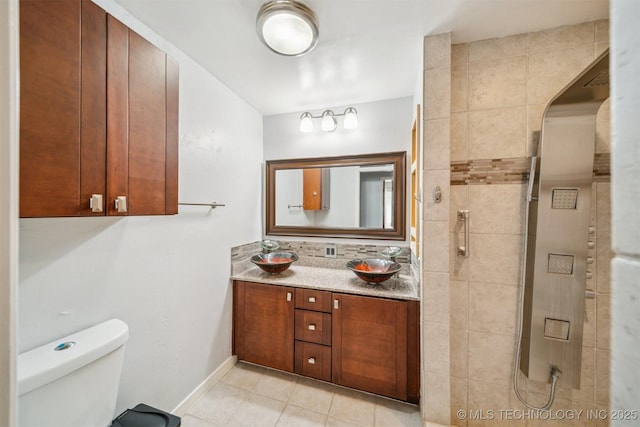4262 E 24th Pl, Tulsa, OK 74114 - bathroom featuring vanity, tile patterned flooring, and tiled shower