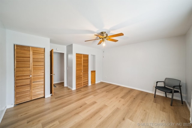 4262 E 24th Pl, Tulsa, OK 74114 - unfurnished bedroom with two closets, light wood-type flooring, and a ceiling fan