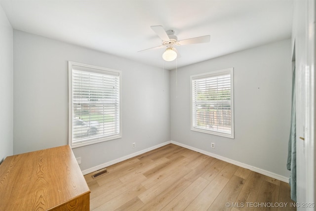 4262 E 24th Pl, Tulsa, OK 74114 - unfurnished bedroom with wood finished floors and a ceiling fan