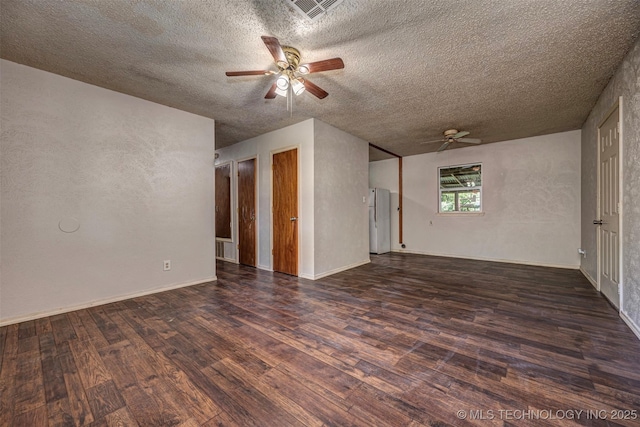 807 E Tahlequah, Sulphur, OK 73086 - unfurnished room featuring a ceiling fan, a textured ceiling, and wood finished floors