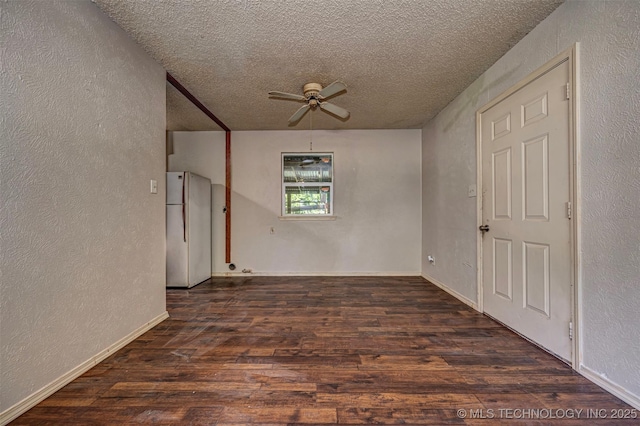 807 E Tahlequah, Sulphur, OK 73086 - unfurnished room with ceiling fan, a textured wall, a textured ceiling, and wood finished floors