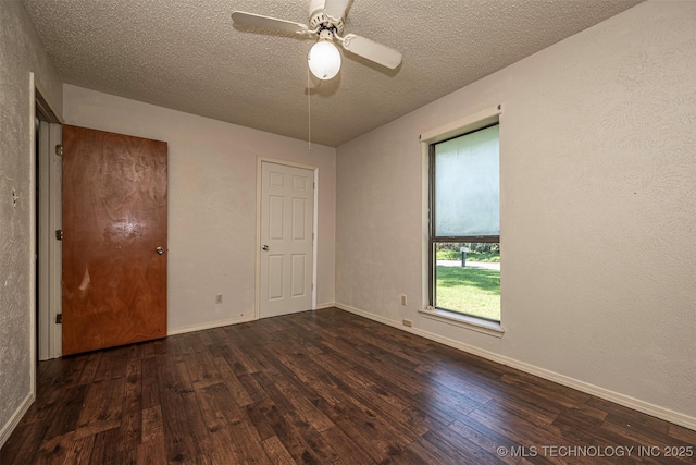 807 E Tahlequah, Sulphur, OK 73086 - spare room featuring hardwood / wood-style flooring, a textured ceiling, and ceiling fan