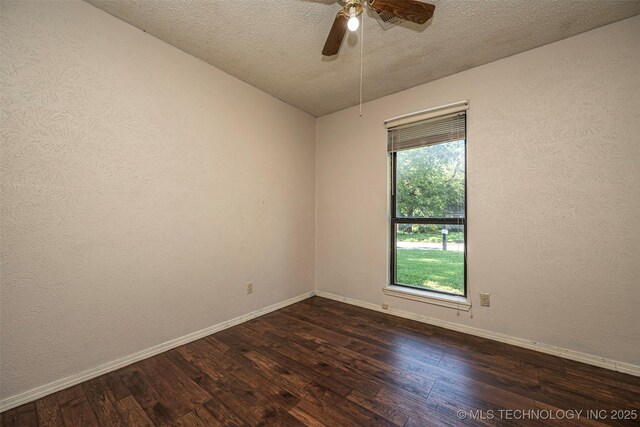 807 E Tahlequah, Sulphur, OK 73086 - empty room with dark wood-type flooring, ceiling fan, and a textured ceiling