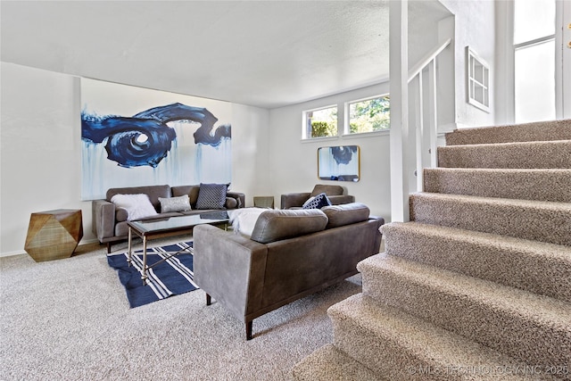 4814 E 68th St Unit 106, Tulsa, OK 74136 - living room featuring stairway and carpet flooring