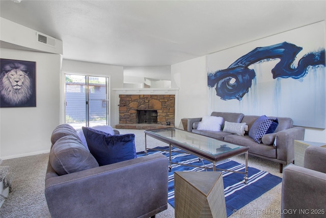 4814 E 68th St Unit 106, Tulsa, OK 74136 - living area featuring carpet floors and a stone fireplace