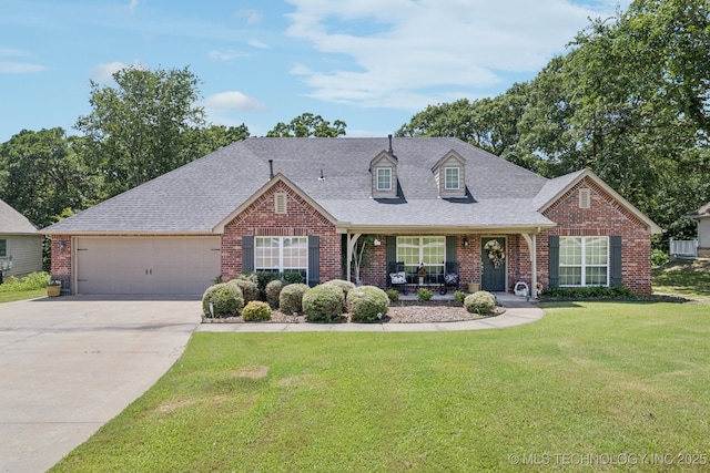 25070 S Red Oak Dr, Claremore, OK 74019 - view of front of house with brick siding, a garage, and concrete driveway