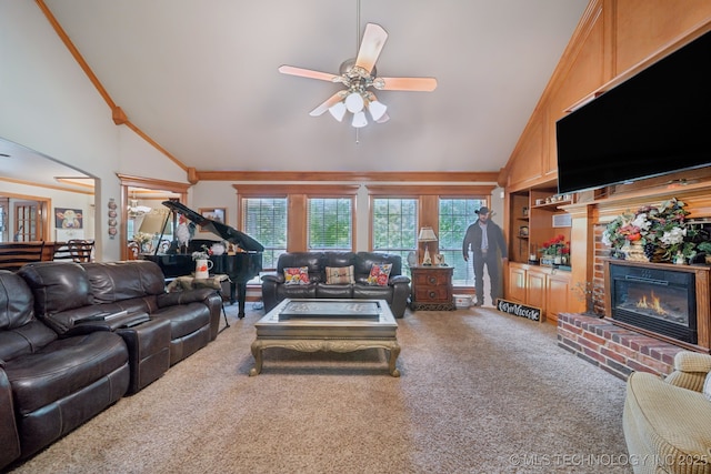 25070 S Red Oak Dr, Claremore, OK 74019 - carpeted living room with vaulted ceiling, plenty of natural light, a brick fireplace, ceiling fan, and ornamental molding
