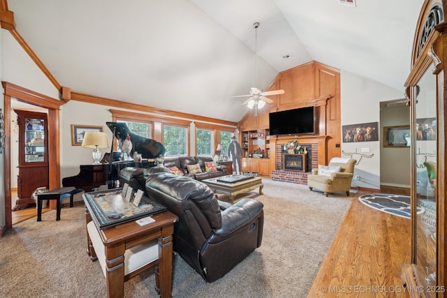 25070 S Red Oak Dr, Claremore, OK 74019 - living room with lofted ceiling, a ceiling fan, a fireplace, and light wood-style floors