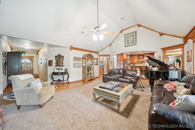 25070 S Red Oak Dr, Claremore, OK 74019 - living area with a ceiling fan, arched walkways, wood finished floors, and high vaulted ceiling