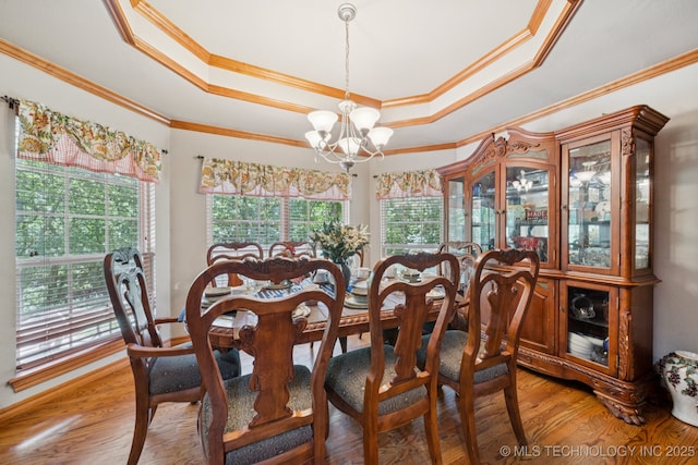 25070 S Red Oak Dr, Claremore, OK 74019 - dining room with a tray ceiling, a chandelier, ornamental molding, and light wood finished floors