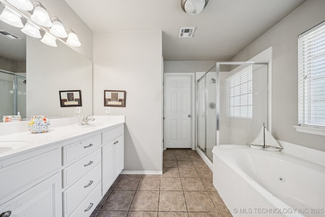 25070 S Red Oak Dr, Claremore, OK 74019 - full bathroom featuring double vanity, a stall shower, a jetted tub, and tile patterned flooring