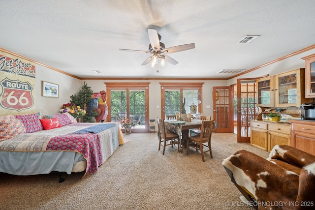 25070 S Red Oak Dr, Claremore, OK 74019 - bedroom featuring ornamental molding, access to outside, light carpet, a textured ceiling, and french doors