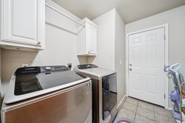25070 S Red Oak Dr, Claremore, OK 74019 - laundry room with cabinet space, separate washer and dryer, and light tile patterned floors