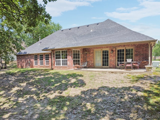 25070 S Red Oak Dr, Claremore, OK 74019 - back of property with a patio area, brick siding, and a shingled roof