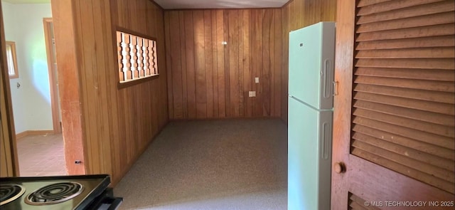 514 W Wichita Ave, Cleveland, OK 74020 - hallway featuring wood walls and carpet flooring
