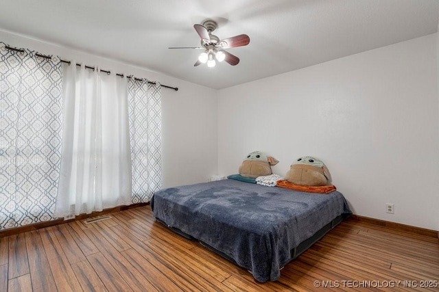 12915 S 120th E Pl, Tulsa, OK 74011 - bedroom with hardwood / wood-style flooring and a ceiling fan