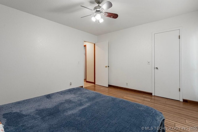 12915 S 120th E Pl, Tulsa, OK 74011 - unfurnished bedroom with wood finished floors and ceiling fan