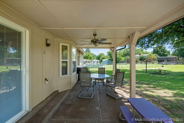 12915 S 120th E Pl, Tulsa, OK 74011 - view of patio featuring outdoor dining space and a ceiling fan