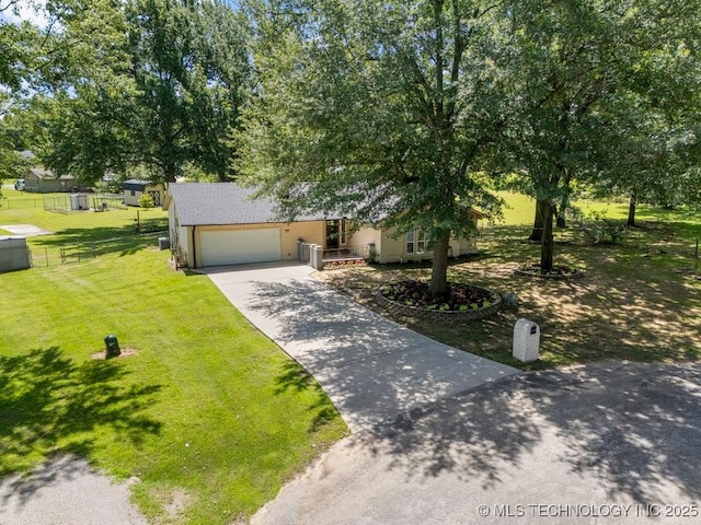 12915 S 120th E Pl, Tulsa, OK 74011 - view of property hidden behind natural elements featuring an attached garage, concrete driveway, and stucco siding