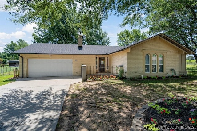 12915 S 120th E Pl, Tulsa, OK 74011 - single story home featuring a garage, brick siding, driveway, and a chimney
