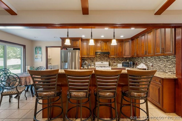 12915 S 120th E Pl, Tulsa, OK 74011 - kitchen with stainless steel fridge with ice dispenser, range, light tile patterned flooring, tasteful backsplash, and recessed lighting