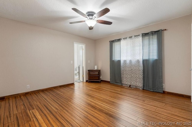 12915 S 120th E Pl, Tulsa, OK 74011 - unfurnished room with ceiling fan and hardwood / wood-style flooring
