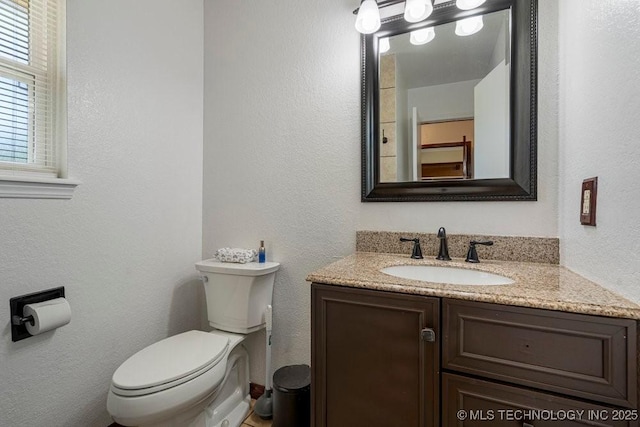 12915 S 120th E Pl, Tulsa, OK 74011 - half bathroom featuring vanity and a textured wall