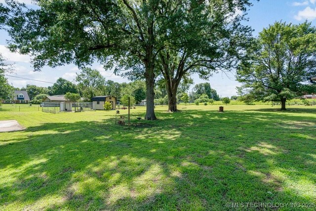 12915 S 120th E Pl, Tulsa, OK 74011 - view of yard featuring a storage shed