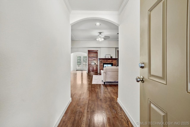 13718 S 262nd E Ave, Coweta, OK 74429 - corridor featuring arched walkways, ornamental molding, and dark wood-style floors