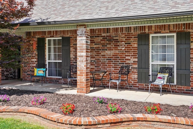13718 S 262nd E Ave, Coweta, OK 74429 - property entrance with roof with shingles and brick siding