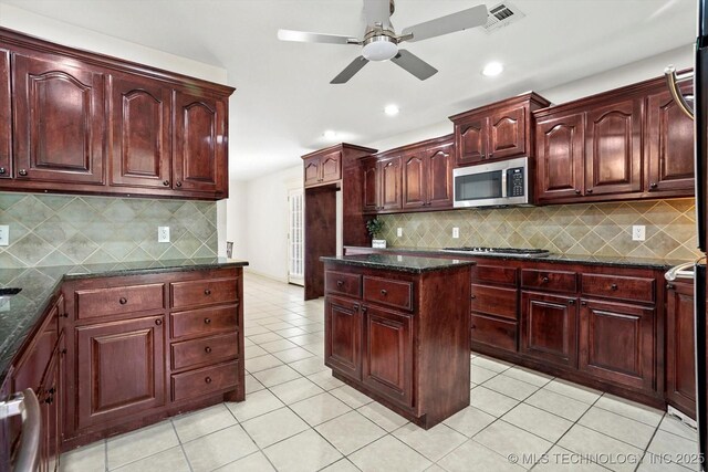 13718 S 262nd E Ave, Coweta, OK 74429 - kitchen featuring appliances with stainless steel finishes, reddish brown cabinets, a ceiling fan, light tile patterned floors, and recessed lighting