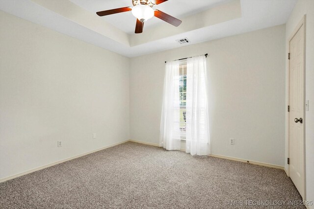 13718 S 262nd E Ave, Coweta, OK 74429 - empty room with a tray ceiling, light carpet, and a ceiling fan