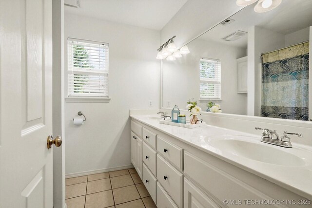 13718 S 262nd E Ave, Coweta, OK 74429 - bathroom featuring double vanity and tile patterned flooring