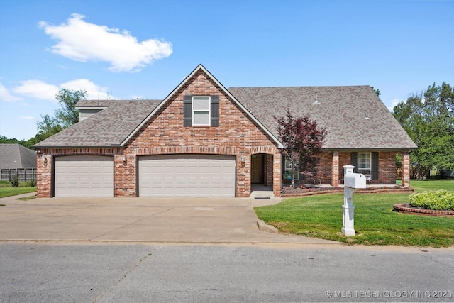 13718 S 262nd E Ave, Coweta, OK 74429 - view of front of house featuring concrete driveway, roof with shingles, a front yard, and brick siding