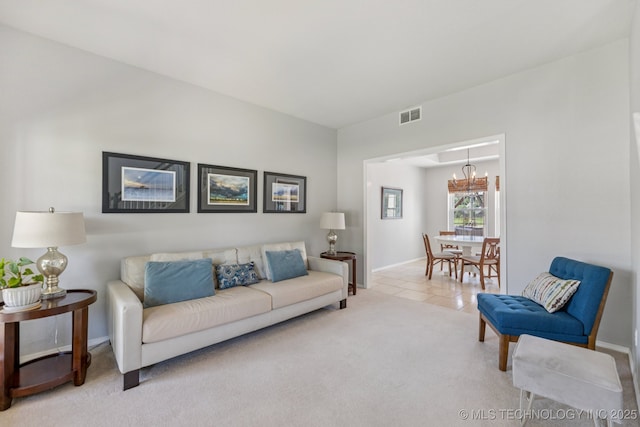 200 N Redwood Ct, Broken Arrow, OK 74012 - tiled living area featuring a chandelier and carpet