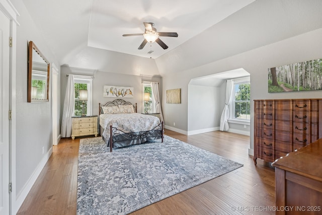 200 N Redwood Ct, Broken Arrow, OK 74012 - bedroom featuring wood finished floors, vaulted ceiling, and a ceiling fan