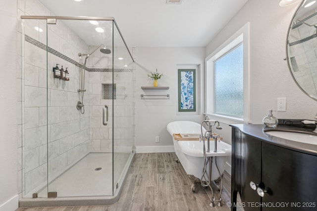200 N Redwood Ct, Broken Arrow, OK 74012 - full bath featuring wood finished floors, a shower stall, a soaking tub, and vanity
