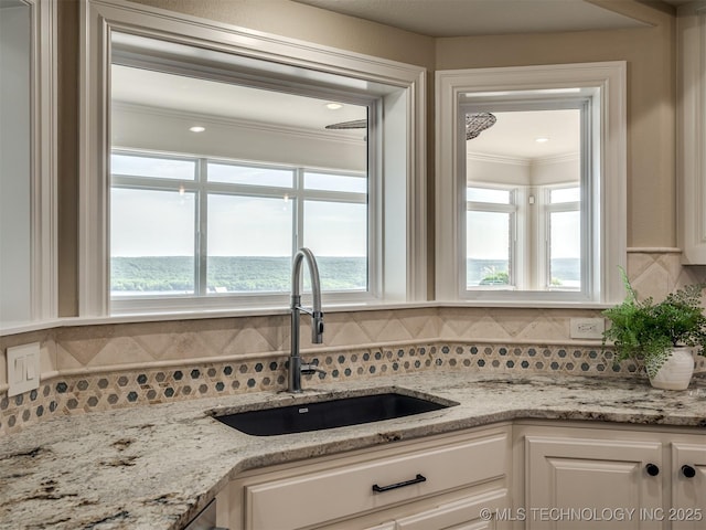 34159 E 698th Rd, Wagoner, OK 74467 - kitchen with white cabinetry, tasteful backsplash, crown molding, and light stone countertops