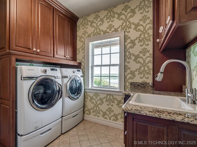 34159 E 698th Rd, Wagoner, OK 74467 - laundry area with wallpapered walls, cabinet space, washing machine and clothes dryer, and light tile patterned floors