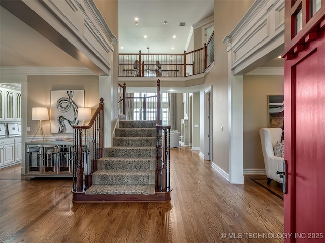 34159 E 698th Rd, Wagoner, OK 74467 - stairs with wood finished floors, crown molding, a high ceiling, and recessed lighting